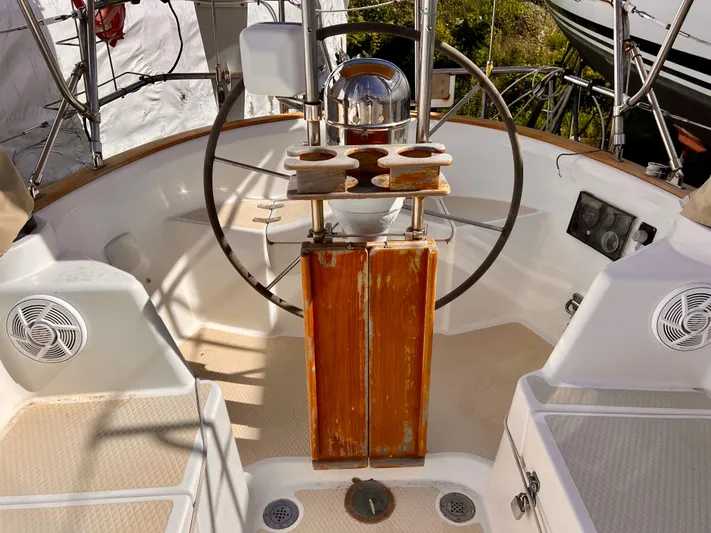 Glory Yacht Photos Pics Cockpit of 2001 Shannon 43 Cutter sailboat with steering wheel and wooden panel.