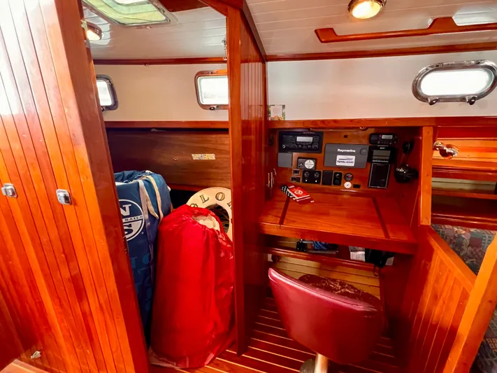 Glory Yacht Photos Pics Interior of 2001 Shannon 43 Cutter sailboat with navigation station and storage area.