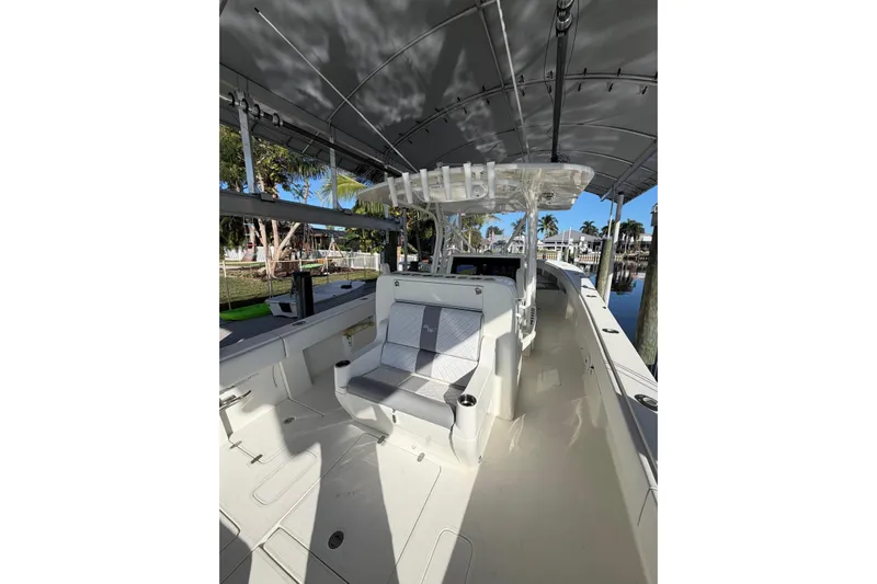  Yacht Photos Pics 2018 SeaVee 390Z boat interior with seating, rod holders, and canopy.