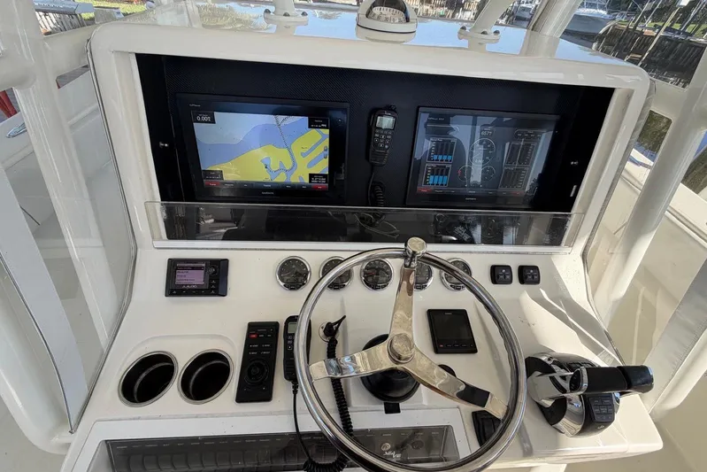  Yacht Photos Pics 2018 SeaVee 390Z helm with navigation screens and controls.