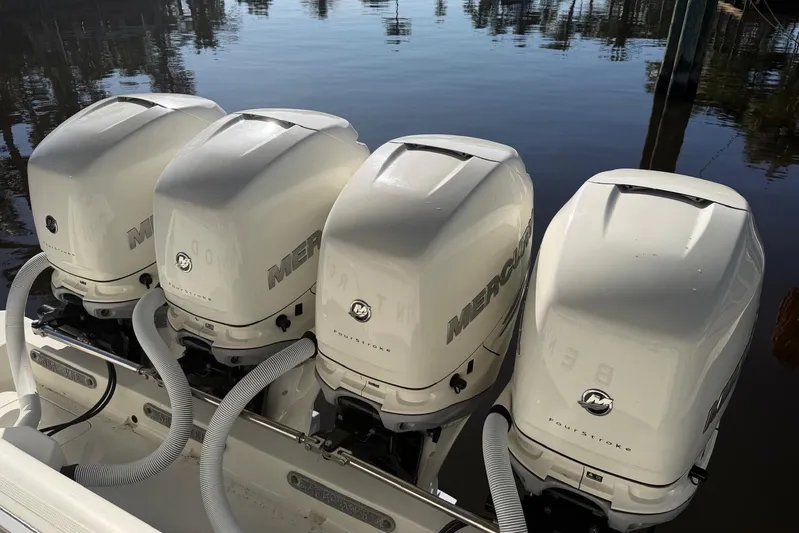  Yacht Photos Pics Four Mercury outboard engines on a 2018 SeaVee 390Z boat, docked by the water.