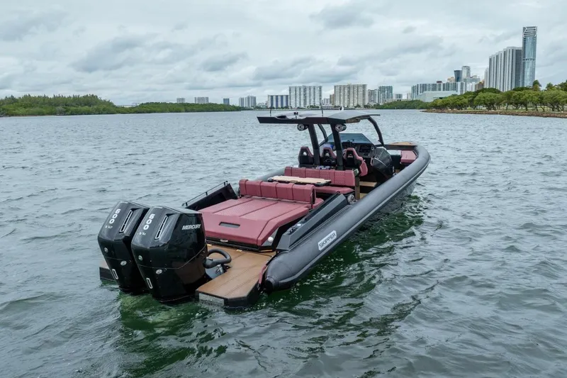  Yacht Photos Pics Skipper-BSK 42 boat, 2023 model, on water with city skyline in background.