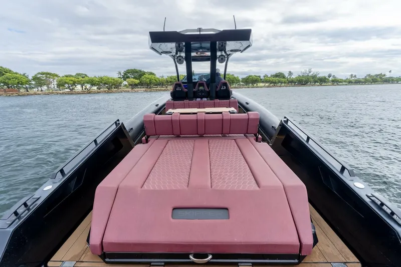  Yacht Photos Pics 2023 Skipper-BSK 42 boat with luxurious seating, cruising on calm waters.