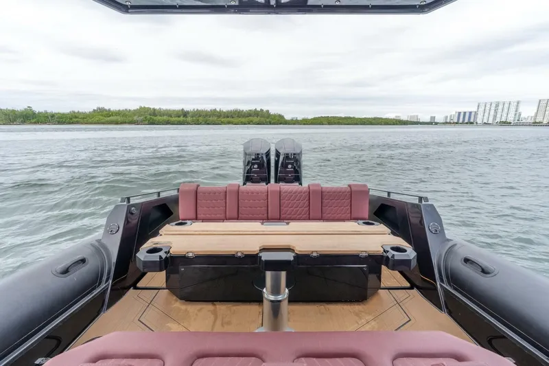  Yacht Photos Pics 2023 Skipper-BSK 42 boat interior with seating and table on open water.