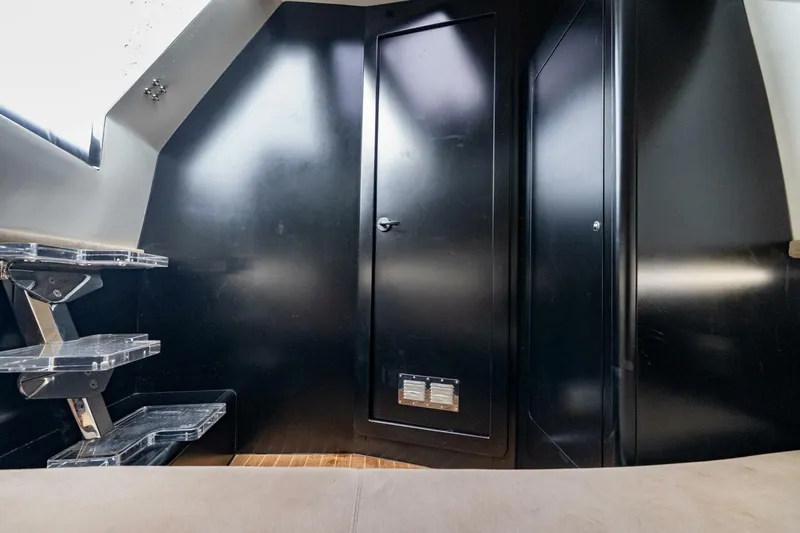  Yacht Photos Pics Interior of 2023 Skipper-BSK 42 boat with sleek black walls and modern design.