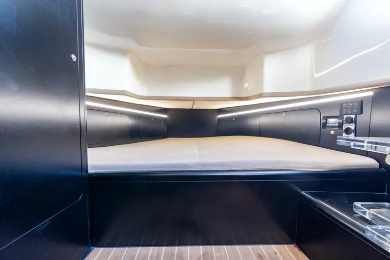  Yacht Photos Pics Luxurious cabin interior of 2023 Skipper-BSK 42 boat, featuring modern design and ambient lighting.