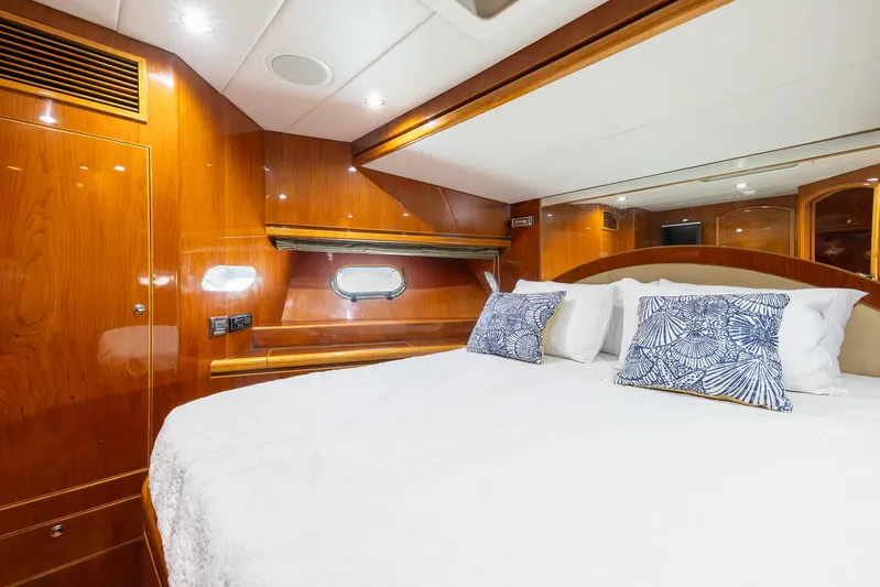 Ocean 1 Yacht Photos Pics Luxurious bedroom interior of 2008 Hargrave Sky Lounge yacht with wood paneling and plush bedding.