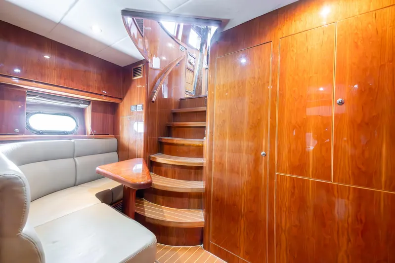 Ocean 1 Yacht Photos Pics Luxurious 2008 Hargrave Sky Lounge interior with wooden finishes and elegant staircase.
