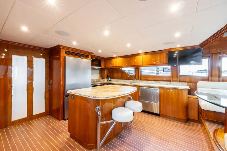 Ocean 1 Yacht Photos Pics Luxurious 2008 Hargrave Sky Lounge yacht kitchen with modern appliances and elegant wood finishes.