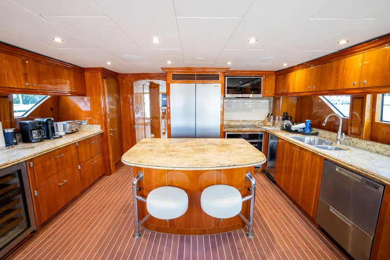 Ocean 1 Yacht Photos Pics Luxurious kitchen in 2008 Hargrave Sky Lounge yacht with wood cabinetry and modern appliances.