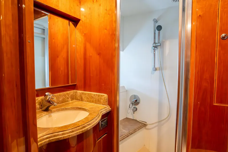 Ocean 1 Yacht Photos Pics Luxurious bathroom in 2008 Hargrave Sky Lounge yacht with wood accents and modern fixtures.