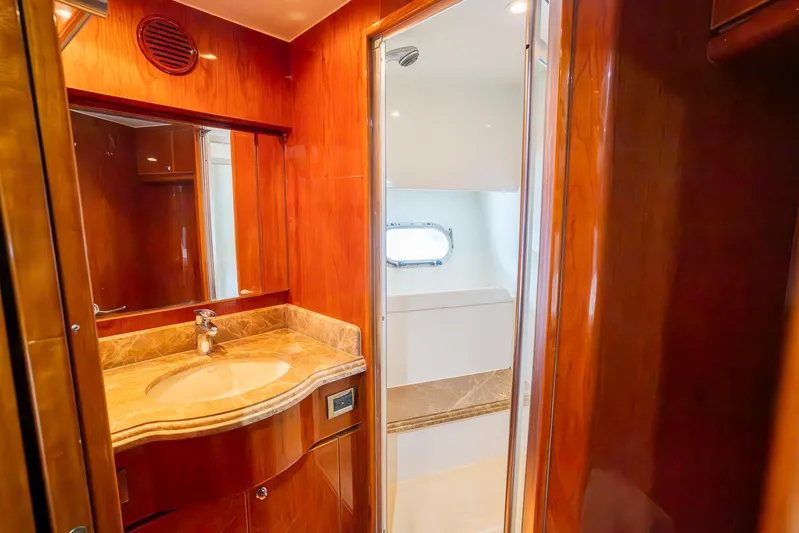 Ocean 1 Yacht Photos Pics Luxurious bathroom in 2008 Hargrave Sky Lounge yacht with wood finish and modern fixtures.