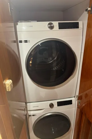 Ocean 1 Yacht Photos Pics Stacked Samsung washer and dryer in a 2008 Hargrave Sky Lounge yacht.