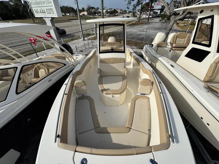  Yacht Photos Pics 2025 Scout 240 XSF boat with beige seating, displayed outdoors.