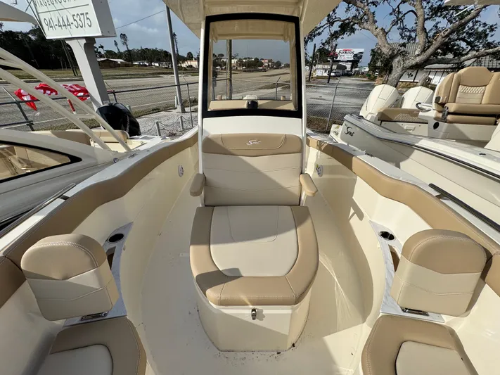  Yacht Photos Pics 2025 Scout 240 XSF boat interior with beige seating and modern design.