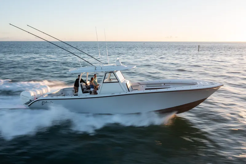  Yacht Photos Pics 2019 Yellowfin 39 boat cruising on open water at sunset.