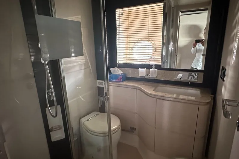  Yacht Photos Pics Luxurious bathroom in 2018 Azimut 66 yacht with modern fixtures and elegant design.