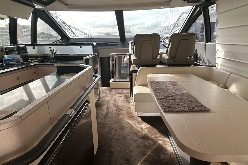  Yacht Photos Pics Interior of 2018 Azimut 66 yacht with modern kitchen and seating area.