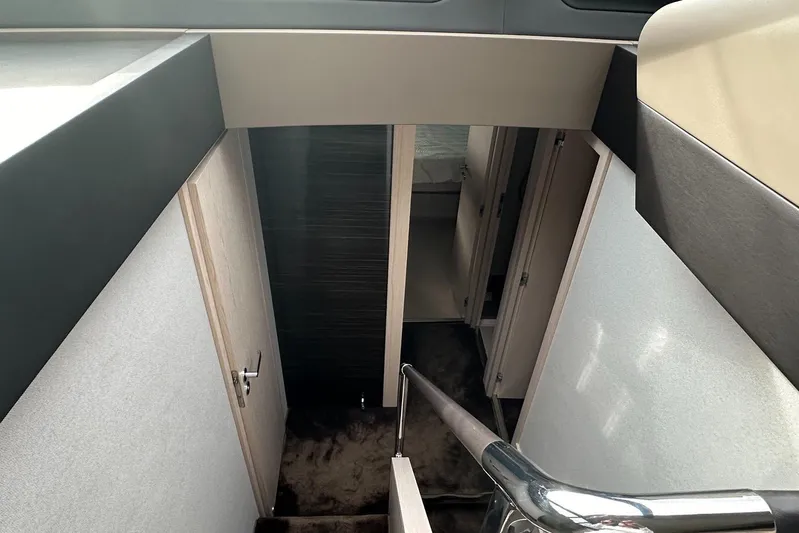  Yacht Photos Pics Interior view of 2018 Azimut 66 yacht, featuring a modern staircase and sleek design.
