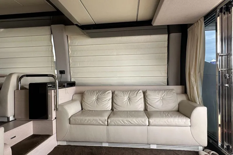  Yacht Photos Pics Luxurious interior of 2018 Azimut 66 yacht with cream leather sofa and modern design.