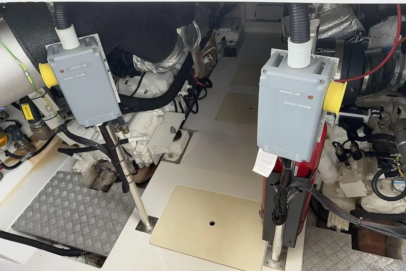  Yacht Photos Pics Engine room of a 2018 Azimut 66 yacht, featuring diagnostic and emergency systems.