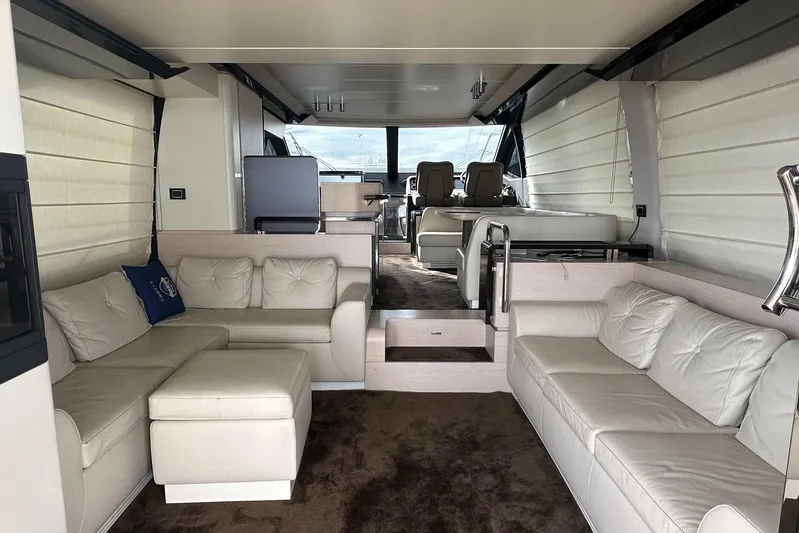  Yacht Photos Pics Luxurious interior of 2018 Azimut 66 yacht with plush white seating and modern design.