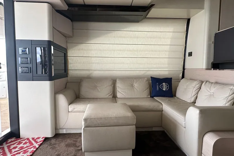  Yacht Photos Pics Luxurious interior of 2018 Azimut 66 yacht with cream leather seating and modern decor.