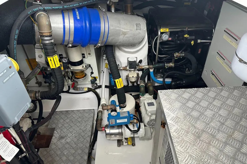  Yacht Photos Pics Engine room of 2018 Azimut 66 yacht with mechanical components and piping.