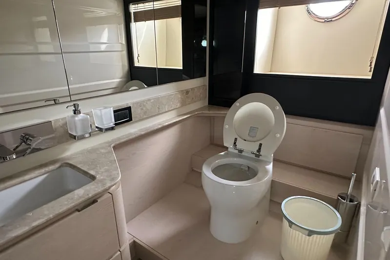  Yacht Photos Pics Luxurious bathroom in 2018 Azimut 66 yacht with modern fixtures and elegant design.
