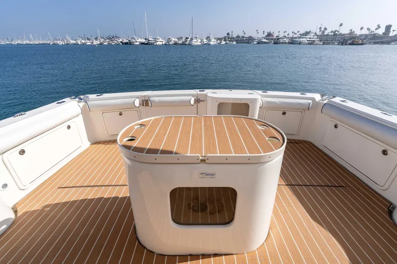 Roll The Dice Yacht Photos Pics 2005 Riviera 47 Convertible yacht deck with ocean view and marina backdrop.