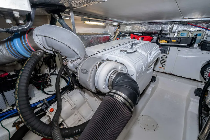 Roll The Dice Yacht Photos Pics Engine room of 2005 Riviera 47 Convertible yacht, showcasing detailed machinery and components.