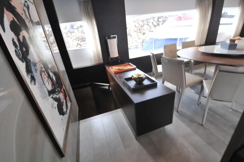  Yacht Photos Pics Luxurious interior of 2017 Ferretti Yachts 850 with modern dining area and abstract art.