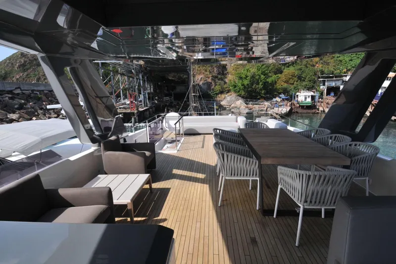 Yacht Photos Pics Luxurious 2017 Ferretti Yachts 850 deck with elegant seating and dining area.