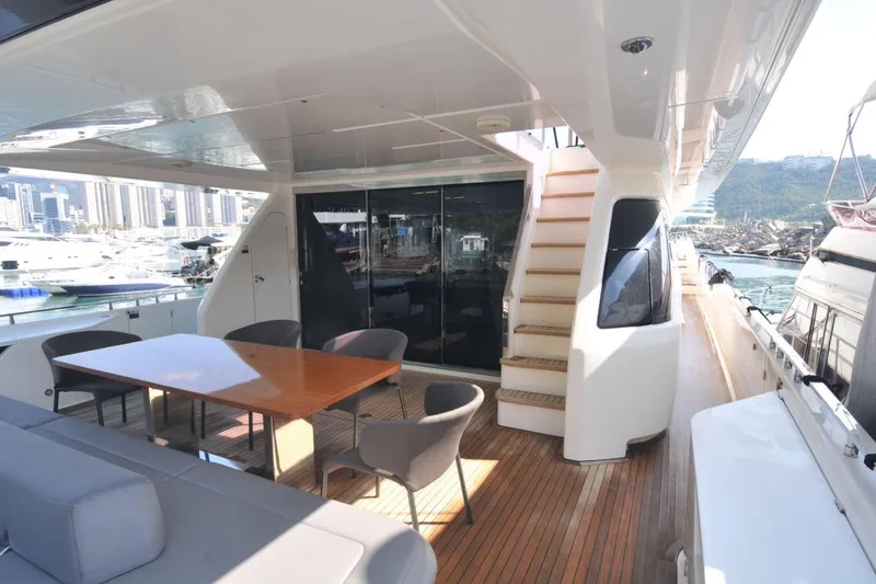  Yacht Photos Pics Luxurious 2017 Ferretti Yachts 850 with elegant outdoor seating and scenic marina view.