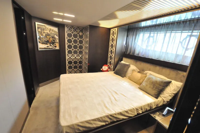  Yacht Photos Pics Luxurious bedroom interior on 2017 Ferretti Yachts 850, featuring elegant decor and modern design.