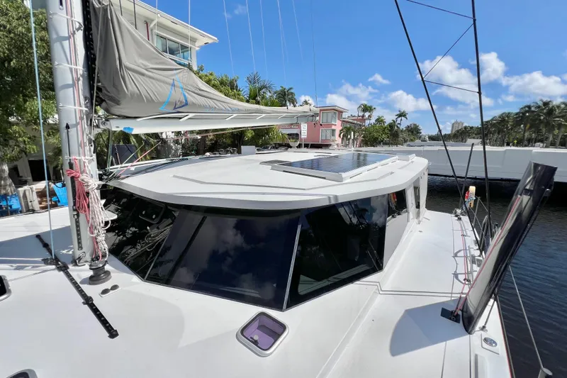 Ke'ala Yacht Photos Pics Sleek 2021 Balance 482 catamaran docked, featuring solar panels and modern design.