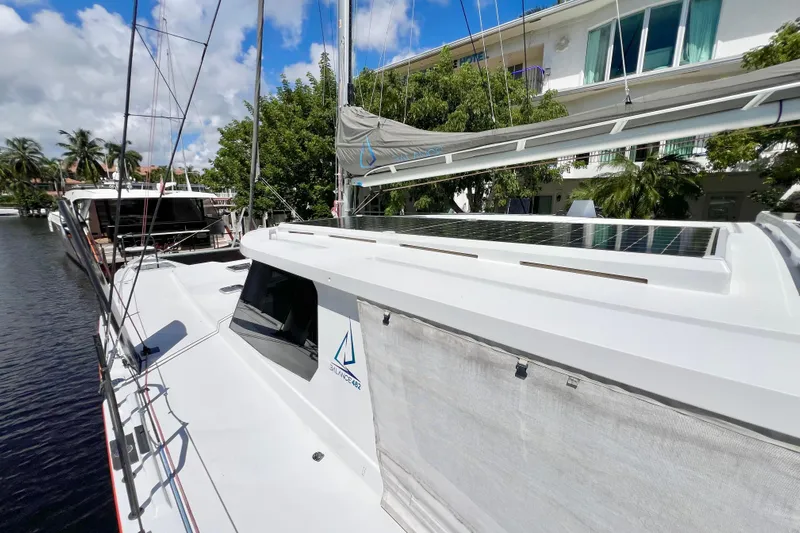 Ke'ala Yacht Photos Pics Sleek 2021 Balance 482 catamaran docked, featuring solar panels and modern design.