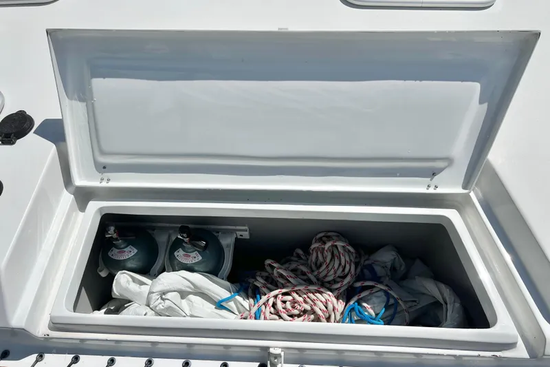 Ke'ala Yacht Photos Pics Open storage compartment on Balance 482 boat, containing ropes and gas cylinders, 2021 model.