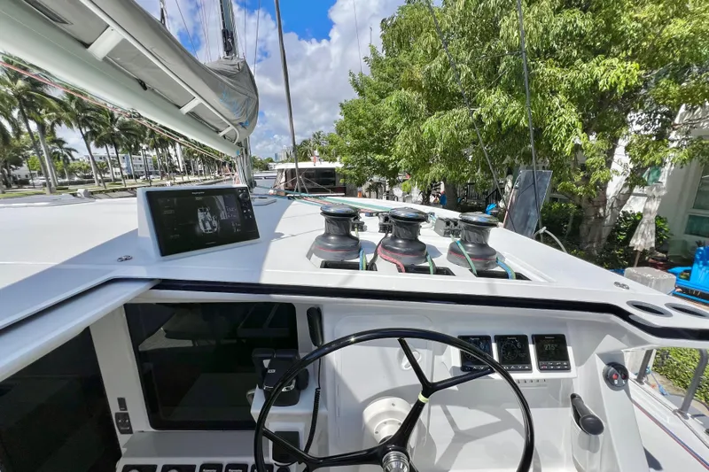 Ke'ala Yacht Photos Pics Sailing yacht cockpit with steering wheel, winches, and navigation display, Balance 482, 2021 model.