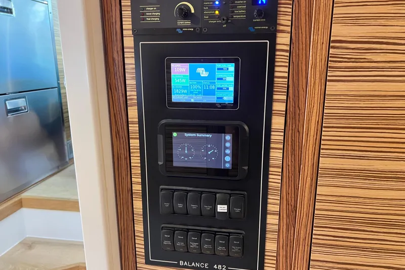 Ke'ala Yacht Photos Pics Control panel of a 2021 Balance 482 yacht with digital displays and switches.