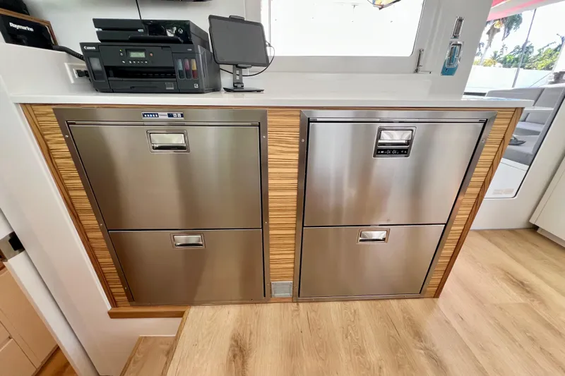 Ke'ala Yacht Photos Pics Modern kitchen with stainless steel appliances, Balance 482 model, 2021, featuring wood accents.