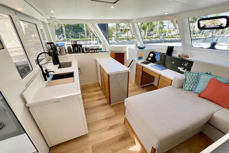 Ke'ala Yacht Photos Pics Modern interior of 2021 Balance 482 yacht with kitchen and lounge area.