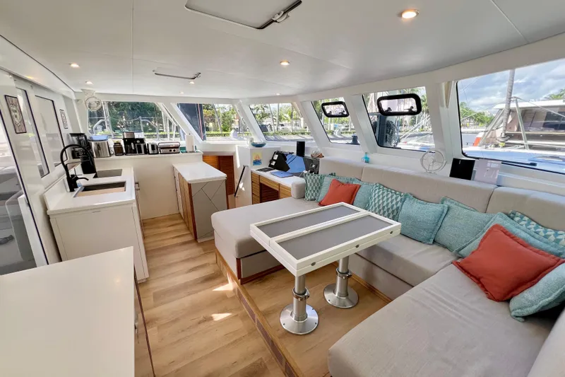 Ke'ala Yacht Photos Pics Luxurious interior of 2021 Balance 482 yacht with modern kitchen and cozy seating area.