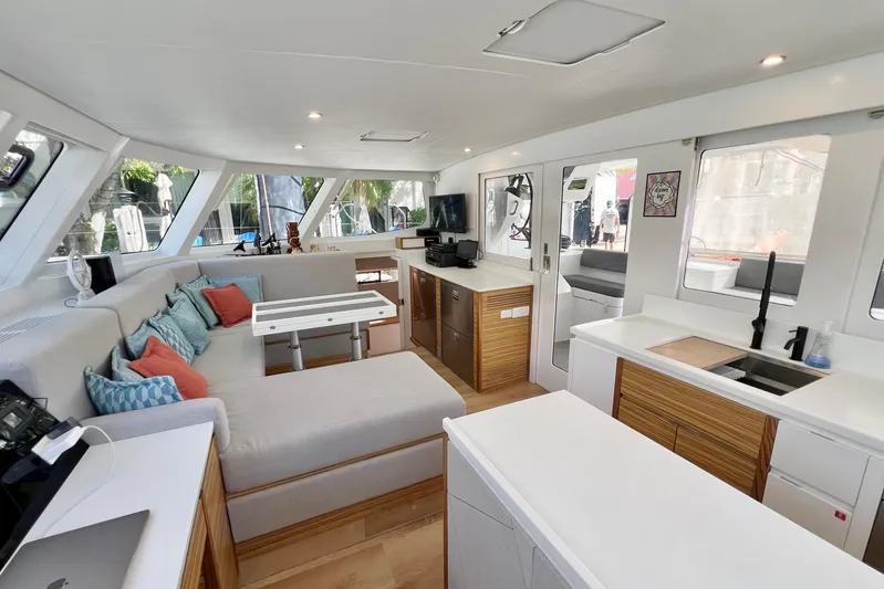 Ke'ala Yacht Photos Pics Luxurious interior of 2021 Balance 482 yacht with modern kitchen and seating area.
