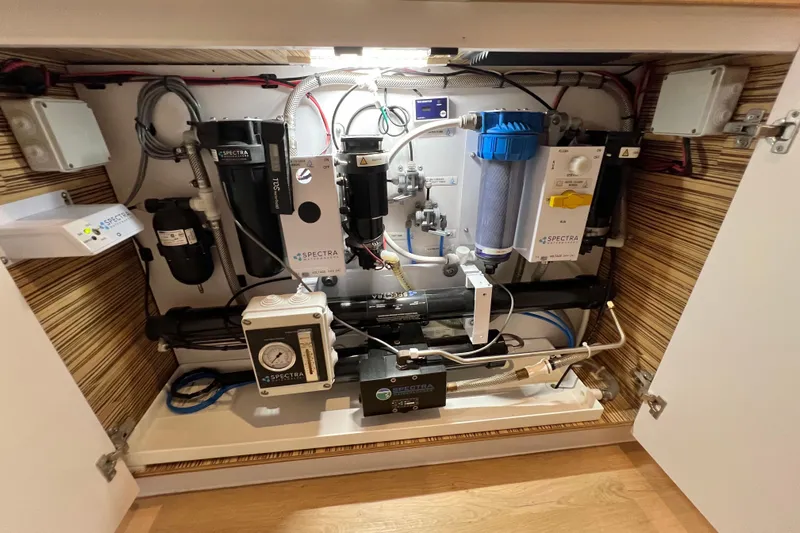 Ke'ala Yacht Photos Pics Water filtration system inside a Balance 482 model, 2021, with various components and wiring.