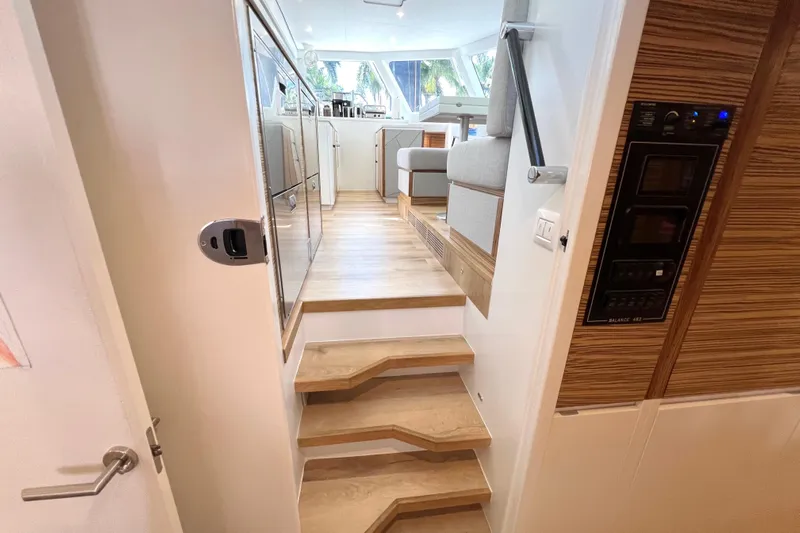 Ke'ala Yacht Photos Pics Interior of 2021 Balance 482 yacht, featuring modern design and wooden stairs.