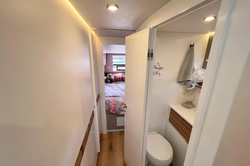 Ke'ala Yacht Photos Pics Compact RV interior with bathroom and cozy bedroom, Balance 482 model, 2021.