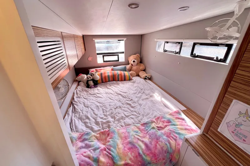 Ke'ala Yacht Photos Pics Cozy bedroom in 2021 Balance 482 yacht with plush toys and colorful decor.