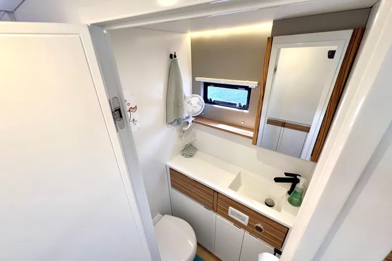 Ke'ala Yacht Photos Pics Compact bathroom in 2021 Balance 482, featuring modern fixtures and wood accents.