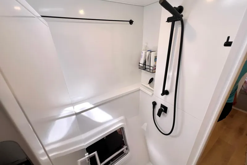 Ke'ala Yacht Photos Pics Modern shower interior in Balance 482, 2021 model, featuring sleek black fixtures.